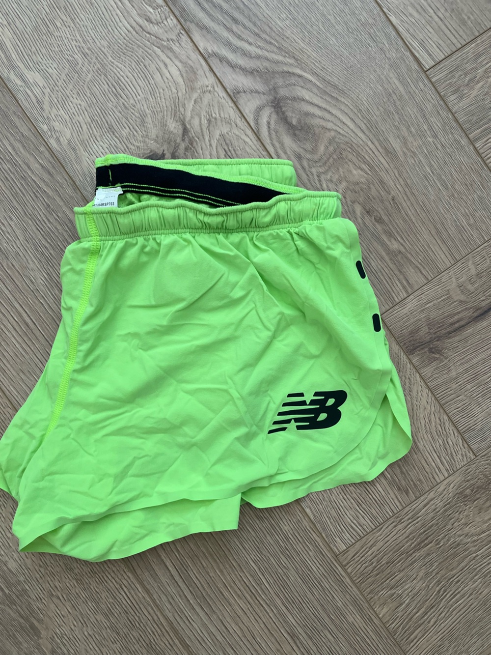 New Balance women’s Neon Green Racing Shorts